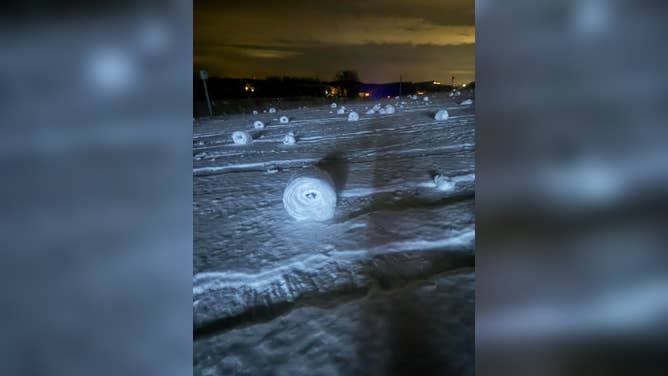 Snow rollers formed in a yard in Suttons Bay, Michigan, on Dec. 16, 2025.