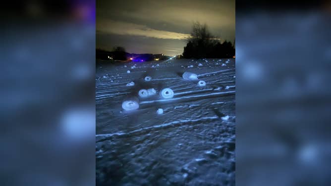 Snow rollers formed in a yard in Suttons Bay, Michigan, on Dec. 16, 2025.