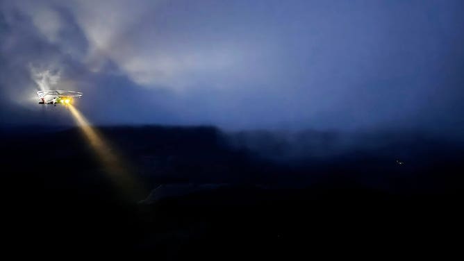 The U.S. Coast Guard attempts to locate the victim by helicopter before conditions worsen.