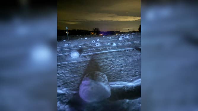 Snow rollers formed in a yard in Suttons Bay, Michigan, on Dec. 16, 2025.