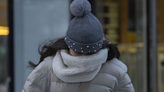 A person walks in freezing cold temperatures in New York City on January 17, 2024.