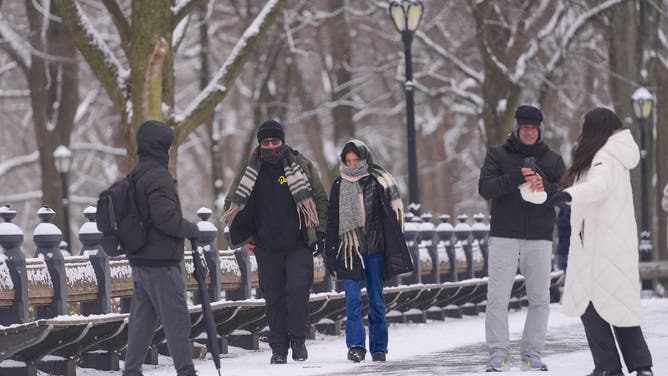 NEW YORK, UNITED STATES - JANUARY 6: People walk through Central Park during cold winter weather in New York, United States on January 6, 2025.