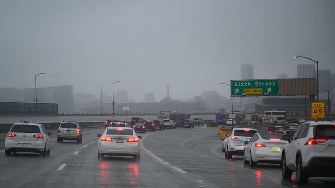 SAN FRANCISCO, CA - DECEMBER 19: A view of cars commute towards to the city during rainy weather as an atmospheric river hits San Francisco Bay Area in California, United States on December 19, 2025. 