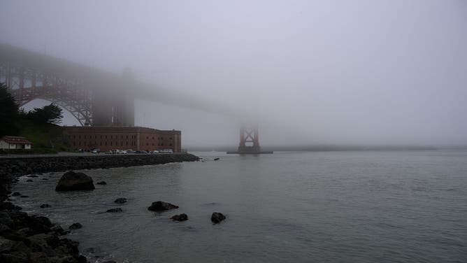 SAN FRANCISCO, CA - DECEMBER 20: A view of Golden Gate Bridge that covered with dense fog near the Fort Point during rainy weather as an atmospheric river hits San Francisco Bay Area in California, United States on December 20, 2025. 