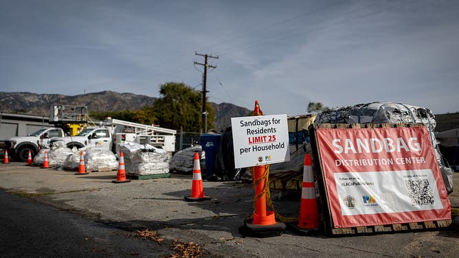 Altadena, CA - December 22: Signs at a location where Los Angeles County Public Works Department workers distribute sandbags to residents at a county works public yard on Monday, Dec. 22, 2025 in Altadena, CA.