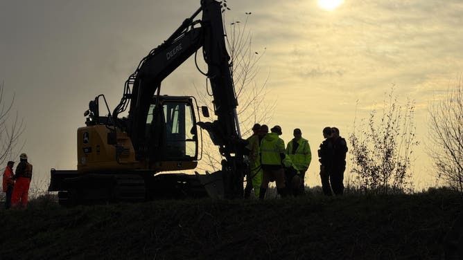 Crews work to repair a levee failure in Washington