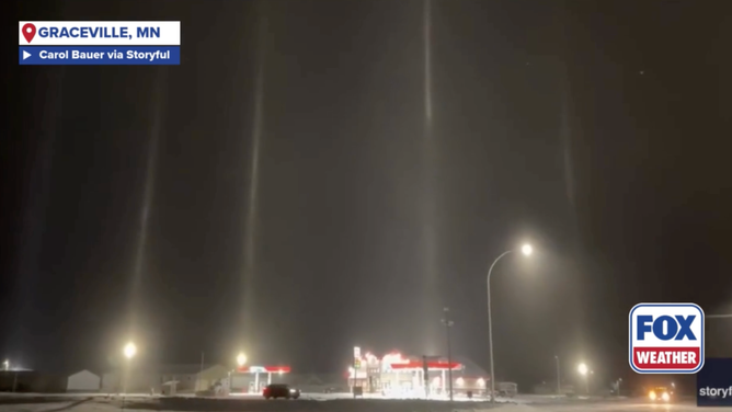 Light pillars reflect ice crystals creating optical illusion in Graceville, Minnesota