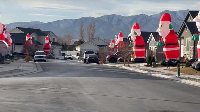 More than 80 identical giant inflatable Christmas lawn decorations took over a Utah neighborhood ahead of the holiday.