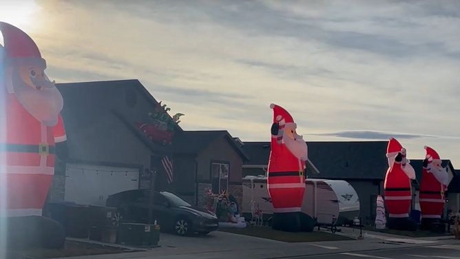 More than 80 identical giant inflatable Christmas lawn decorations took over a Utah neighborhood ahead of the holiday.