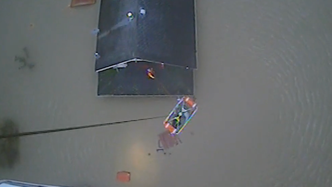 The first person was transported up to the helicopter.