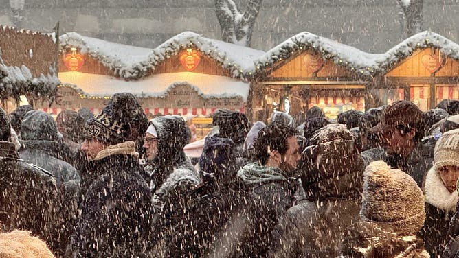 Snow falls across Chicago.