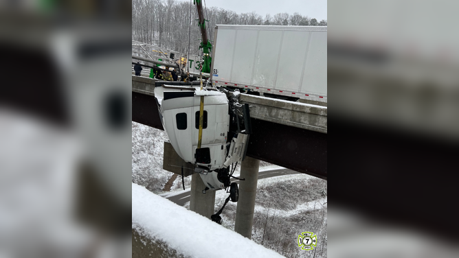 Multiple fire departments collaborate on a risky rescue involving a semi-truck that crashed off a bridge in West Virginia amid intense winter weather.