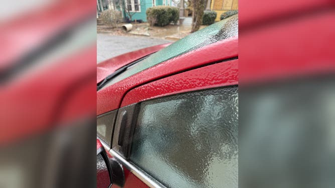 Layer of ice covers cars in Asheville, North Carolina Sunday.