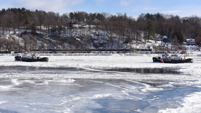 Coast Guard Cutter Hawser (left) and Coast Guard Cutter Wire (right) transit northbound on the ice-covered Hudson River near Saugerties, New York, Jan. 5, 2018.