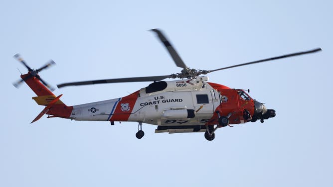 SAN DIEGO, CALIFORNIA - MAY 9: A U.S. Coast Guard Sikorsky MH-60T Jayhawk helicopter approaches the U.S. Coast Guard Air Station San Diego on May 9, 2025 in San Diego, California.