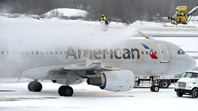 FILE - COLONIE, NY - FEBRUARY 6: An American Airlines jet is deiced before departure on Thursday, Feb. 6, 2025, at Albany International Airport in Colonie, N.Y.