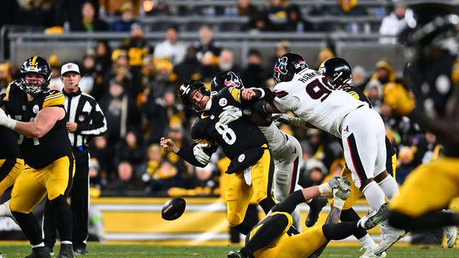 PITTSBURGH, PENNSYLVANIA - JANUARY 12: Will Anderson Jr. #51 of the Houston Texans forces Aaron Rodgers #8 of the Pittsburgh Steelers to fumble the ball and Sheldon Rankins #90 of the Houston Texans returns it for a touchdown in the fourth quarter of an NFL wild card playoff game at Acrisure Stadium on January 12, 2026 in Pittsburgh, Pennsylvania.