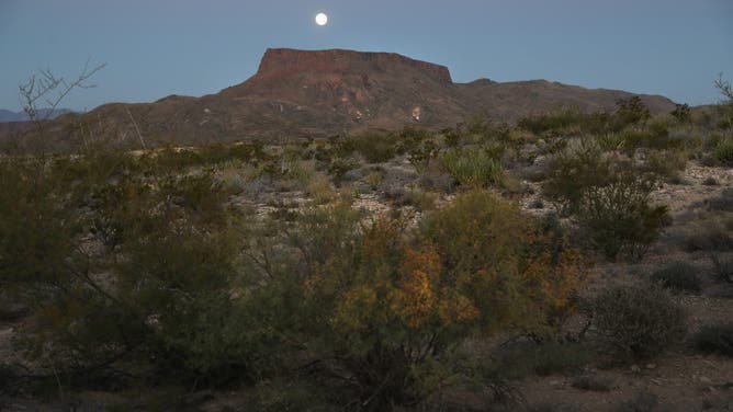 TERLINGUA, TX - OCTOBER 16: A full moon sets on October 16, 2016 in the Big Bend region of near Terlingua in west Texas.