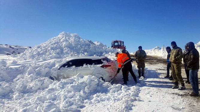 DIYARBAKIR, TURKEY - FEBRUARY 1: A car covered with snow is stuck in Diyarbakir, Turkey on February 2, 2017. 4 people who stuck in the car have been rescued after 14 hour by search and rescue teams.