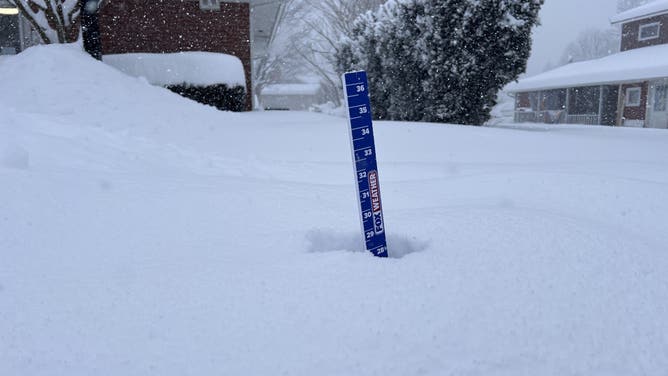 A measuring stick shows 28 inches of snow in Fair Haven, New York on Jan. 2, 2026.