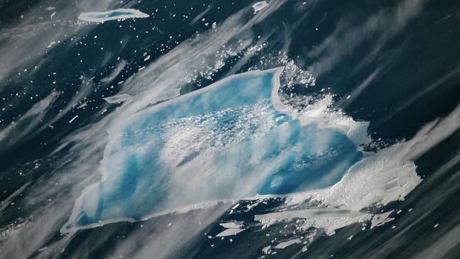 Photo taken on Dec. 27, 2025, shows A-23A with blue meltwater atop it as it continues to melt and near disintegration. 