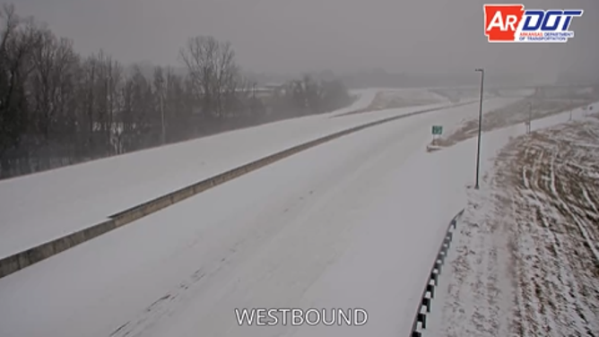 Snow blankets Interstate 440 outside the Little Rock Airport early Saturday.