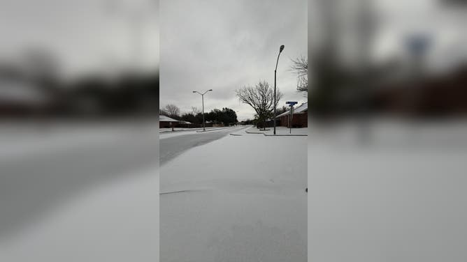 Snow and ice cover roads in Round Rock, Texas, Sunday.