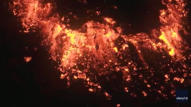 The lava cracked and popped as it spilled from the fissure in Mount Etna.