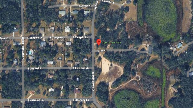 Photo shows an aerial view of Sportsman Park in Inverness, Florida, where two teens died after a hand-dug hole collapsed.