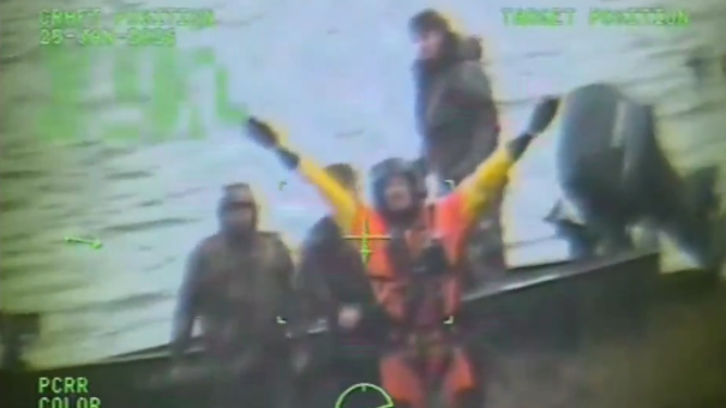 U.S. Coast Guard members rescue three duck hunters.