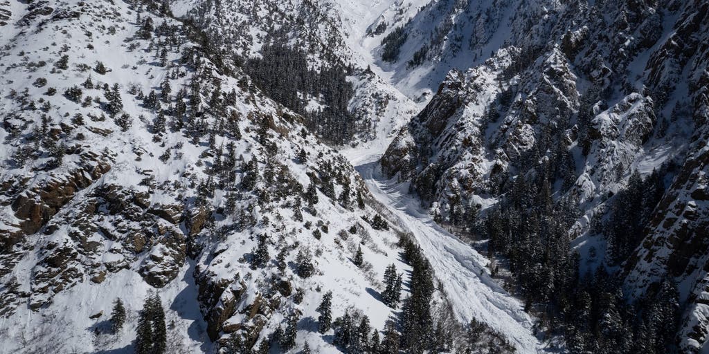 Man dead after sudden avalanche occurs while he and his son go snowmobiling in Utah