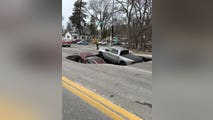 Video: Large sinkhole swallows two vehicles in Nebraska