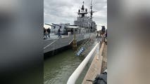 30 people rescued from World War II destroyer after walkway collapses into water in South Carolina
