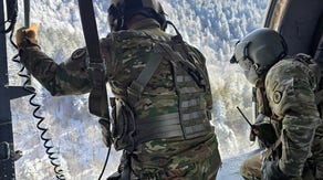 Photos: Tennessee National Guard use Black Hawk helicopter to rescue injured hiker in snowy mountain
