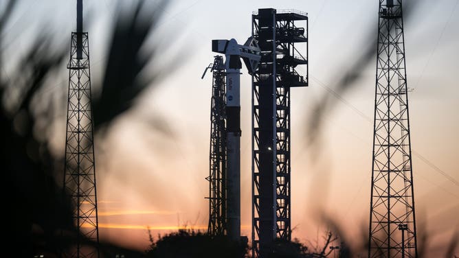 A SpaceX Falcon 9 rocket with the company's Dragon spacecraft on top is seen on the launch pad at sunset at Space Launch Complex 40 as preparations continue for the Crew-12 mission, Tuesday, Feb. 10, 2026, at Cape Canaveral Space Force Station in Florida.