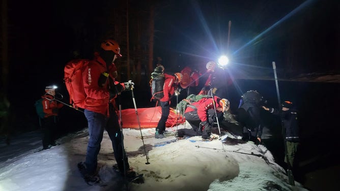 Members of the Washoe County Search and Rescue Team set up a hiker on a sled to be extracted from the Mount Rose Summit.