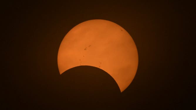 TOPSHOT - Partial view of the solar annular eclipse in Puerto San Julian, Santa Cruz province, Argentina, taken on October 2, 2024
