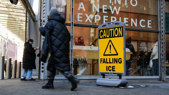 NEW YORK, NEW YORK - FEBRUARY 04: A sign for falling ice warns pedestrians on February 04, 2026 in New York City.