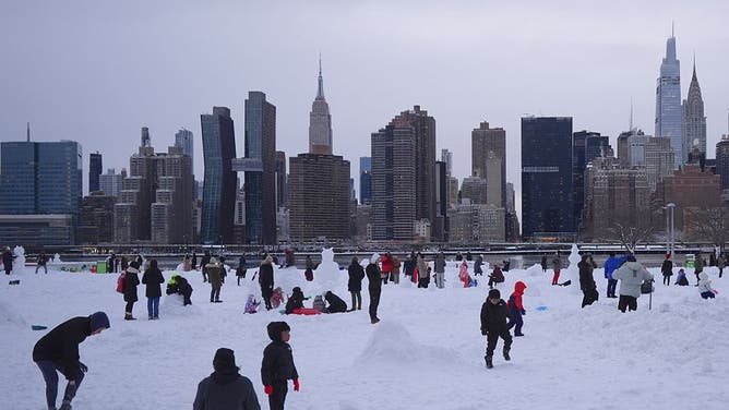 NEW YORK, UNITED STATES - FEBRUARY 23: Families and citizens enjoy snow after a powerful, multi-day blizzard dumped about 19 inches of snow in Long Island City, New York, United States on February 23, 2026.