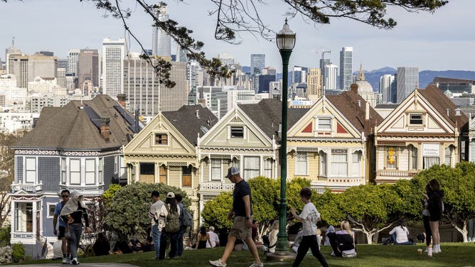 Visitors are seen at Alamo Square Park on an unseasonably warm winter day in San Francisco, Friday, Feb. 27, 2026.