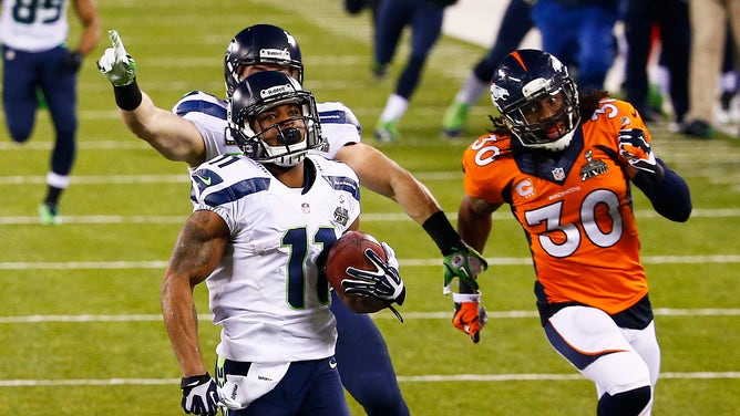 EAST RUTHERFORD, NJ - FEBRUARY 02: Wide receiver Percy Harvin #11 of the Seattle Seahawks returns the second half kickoff for 87 yards during Super Bowl XLVIII at MetLife Stadium against the Denver Broncos on February 2, 2014 in East Rutherford, New Jersey.