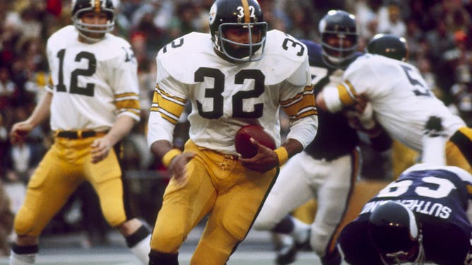 Pittsburgh Steeler Hall of Fame running back Franco Harris on a run through in a 16-6 win over the Minnesota Vikings in Super Bowl IX on January 12, 1975 at Tulane Stadium in New Orleans, Loiusiana. Harris was named the game's MVP with a Super Bowl rushing record of 158-yards.