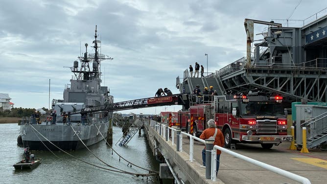Mount Pleasant Firefighters use a ladder truck to safely extract 30 stranded people on the USS Laffey.