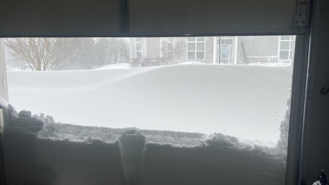 Photo of snowdrift outside a garage in Yaphank, NY