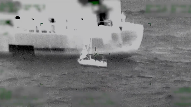 The small sailboat was tethered to the tanker as the mariners were brought aboard.