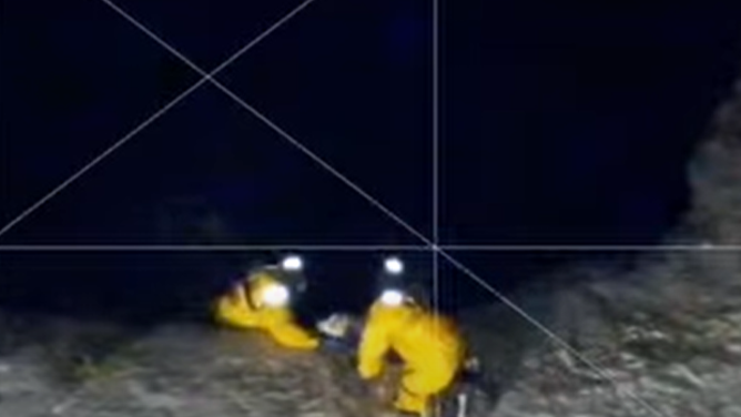 Firefighters in Massachusetts slide into a frozen pond to rescue a trapped dog on Tuesday (Feb. 10, 2026).