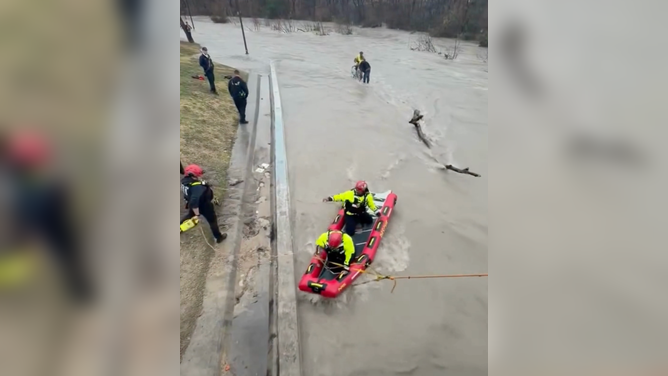 Dallas Fire-Rescue carried out a swift water rescue Saturday, Feb. 14, when two men and their bike became trapped on a trail by the rising waters of Cottonwood Creek.