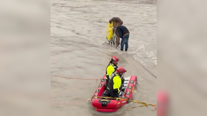 Dallas Fire-Rescue carried out a swift water rescue Saturday, Feb. 14, when two men and their bike became trapped on a trail by the rising waters of Cottonwood Creek.