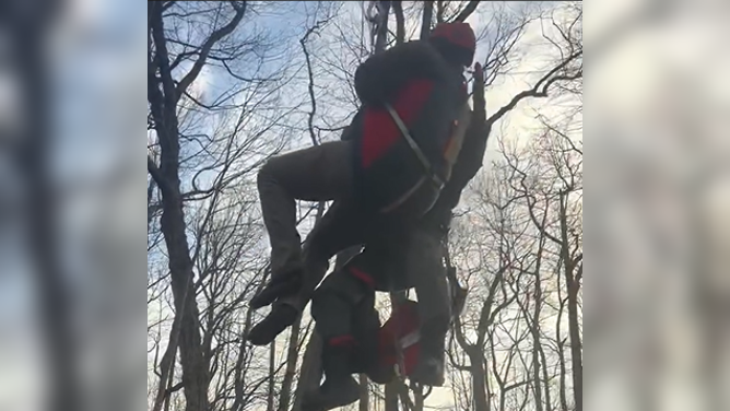 Rescuers use a helicopter to extract a hiker in Georgia.