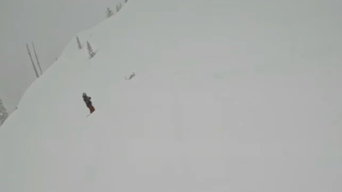 Schmidt notices the man buried in snow.